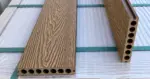 Teak composite decking board — close-up of the wood grain and hollow core